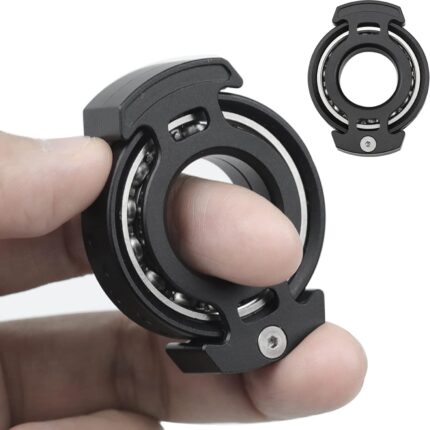 Hand holding black fidget spinner toy.